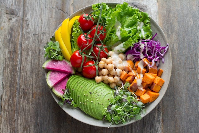 Salad bowl of nutrient dense foods that boost mood.