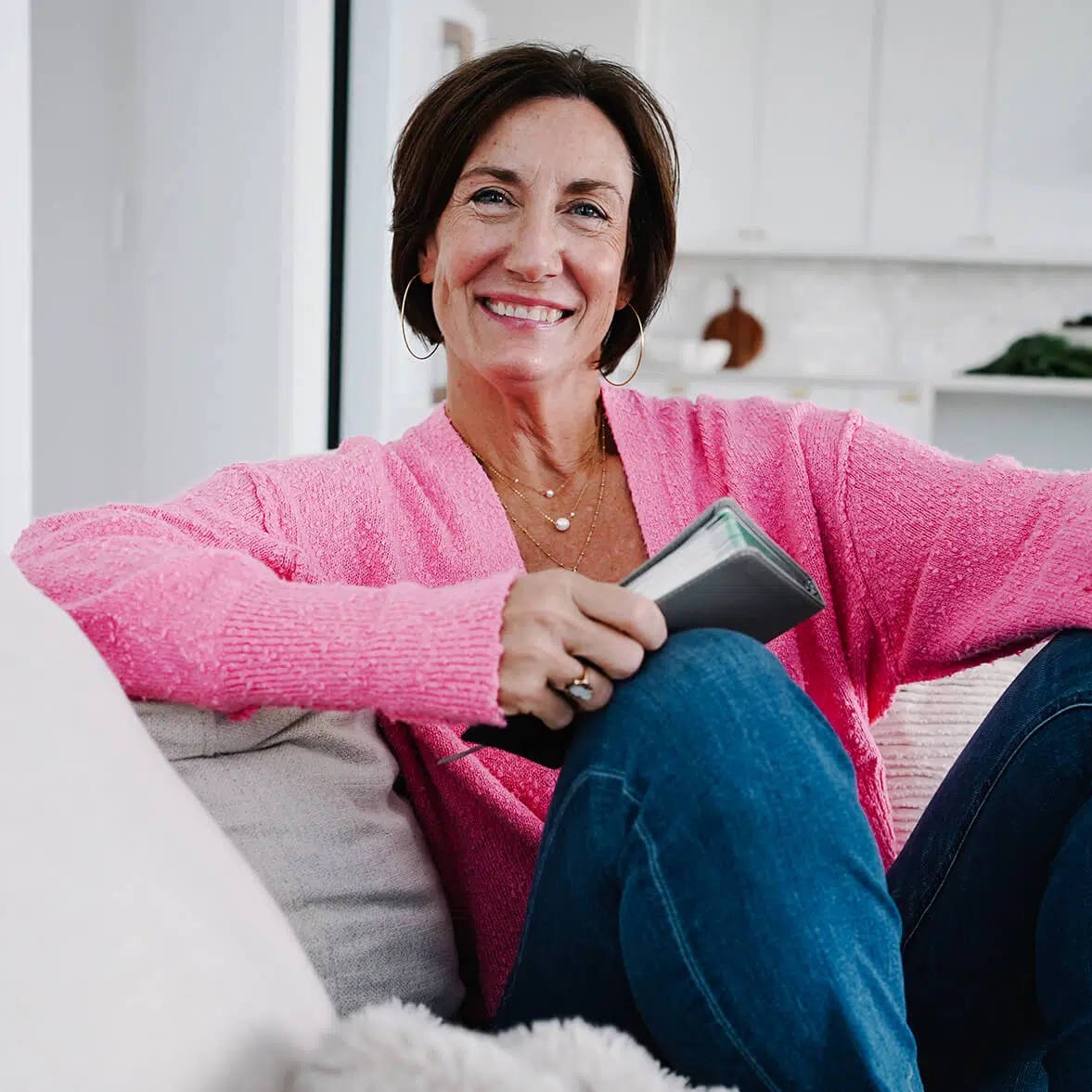 Ann Hackman sitting with a book