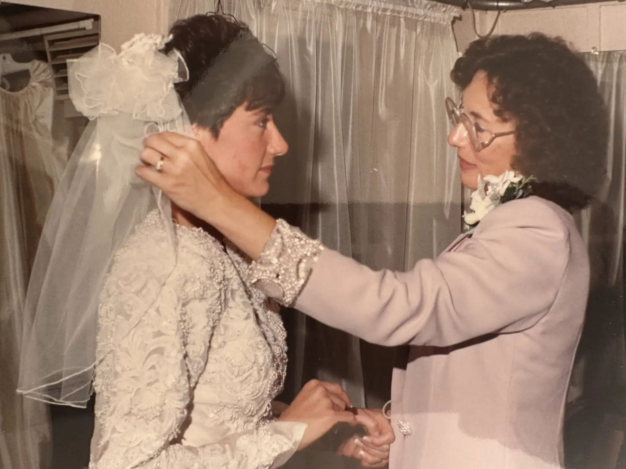 Ann's mother, before her passing from hereditary heart disease, helping her get ready on her wedding day.